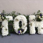 #### country based letters with mixed foliage edging  £35 per letter