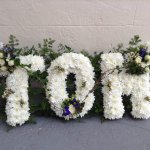#### country based letters with mixed foliage edging  £35 per letter