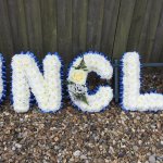 #### White based UNCLE with ribbon and posies (other colours available) £175