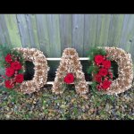 #### Bespoke Gold DAD with foliage edging and rose posies £120