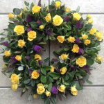 ###  Rose and spray rose wreath in yellow and purple with mixed foliage (other colours available)  
 16