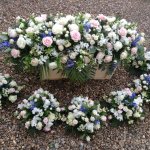 #### Luxury rose Casket Spray with seasonal filler flowers and mixed foliage  (colours to suit)
 small 3ft  £145    medium 4ft  £195    large 5ft  £245 (as shown)   Matching posies @ £50 each 